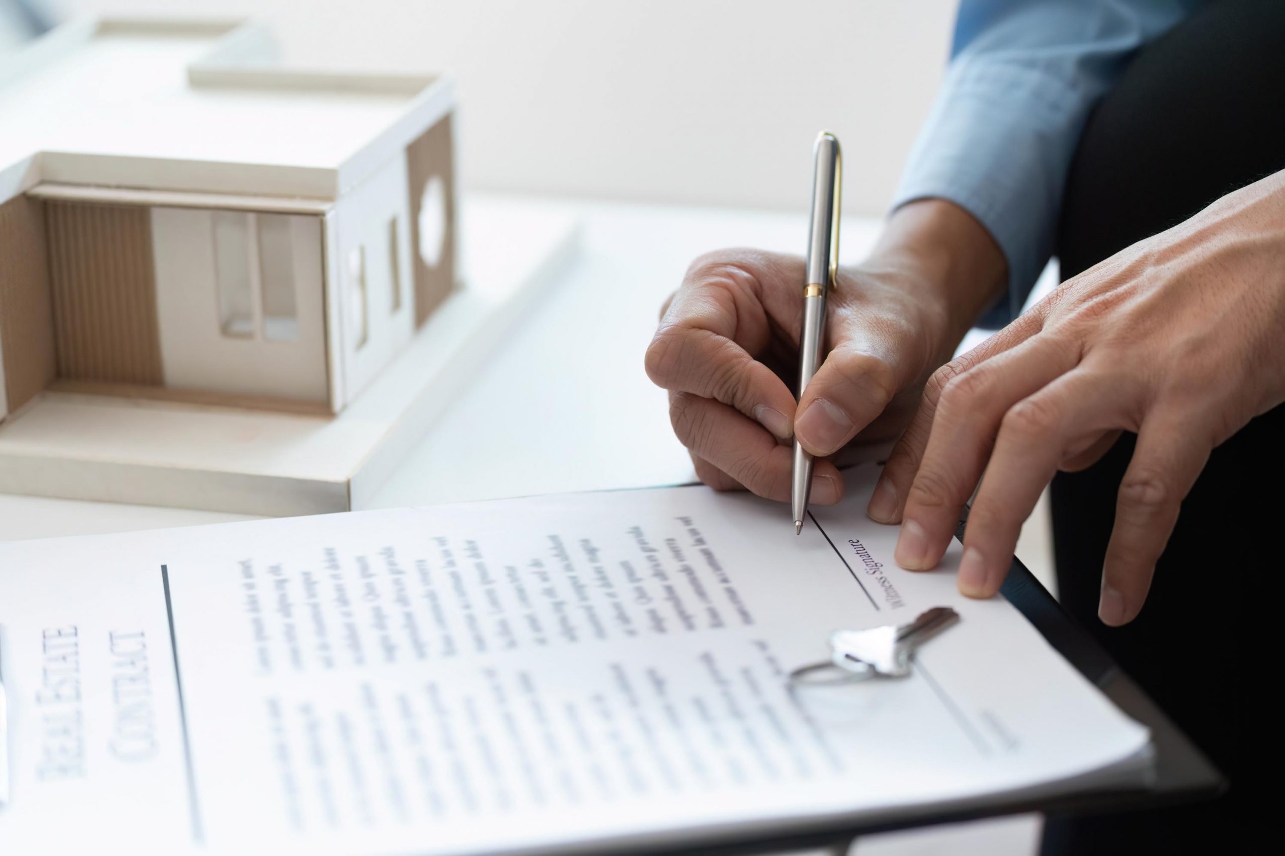 Signing Contract. Real estate agent completing paperwork for property sale.