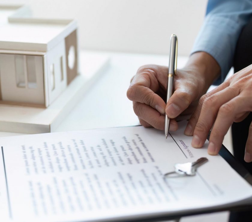Signing Contract. Real estate agent completing paperwork for property sale.
