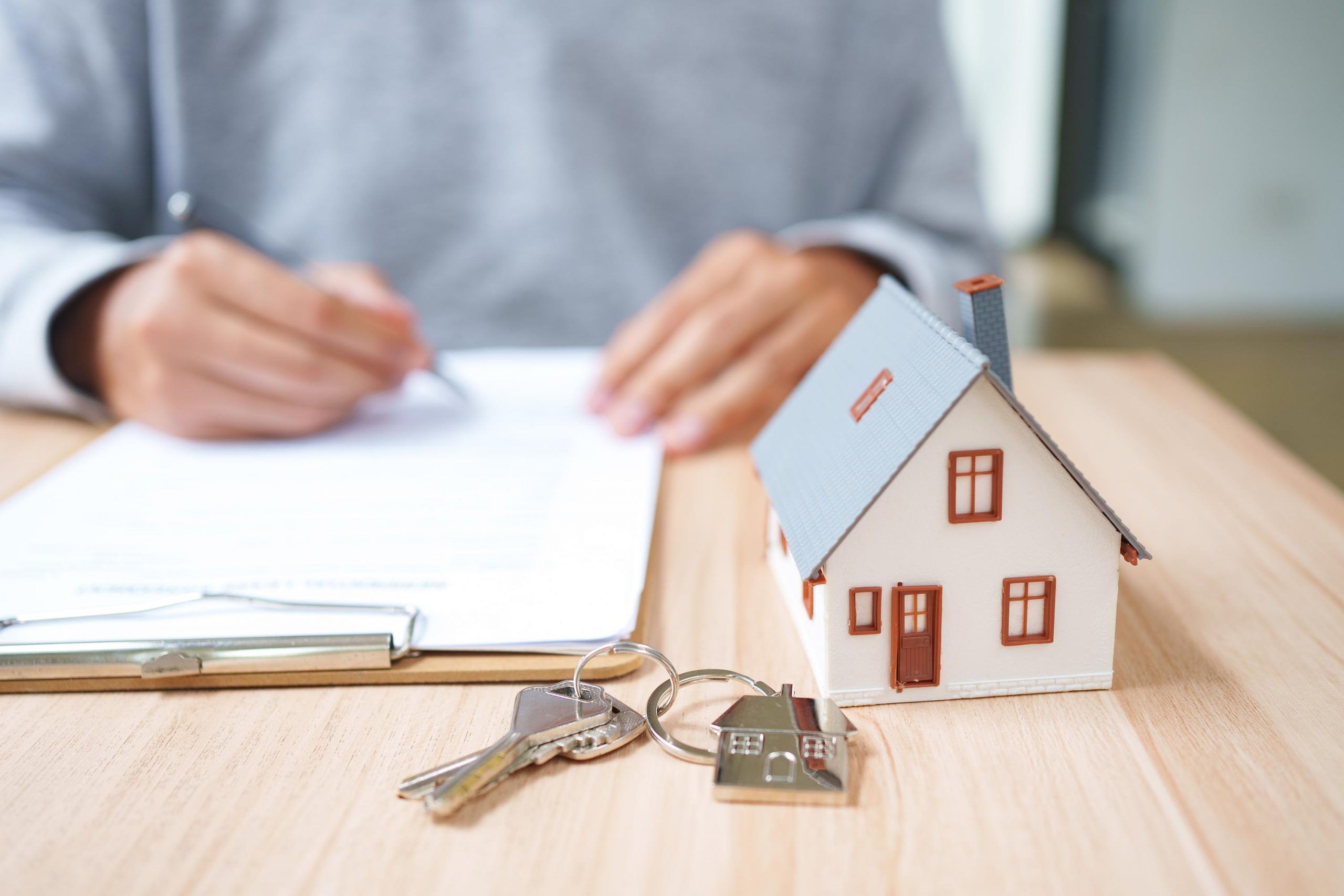 Real Estate Contract Signing For Property Purchase Mortgage Documentation And Ownership Transfer.