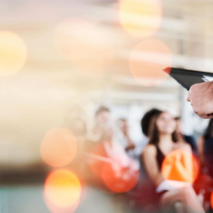 Podium, business and presentation, speaker and audience, conference and banner with mockup space. Corporate training, people at seminar and communication, leadership and public speaking with bokeh