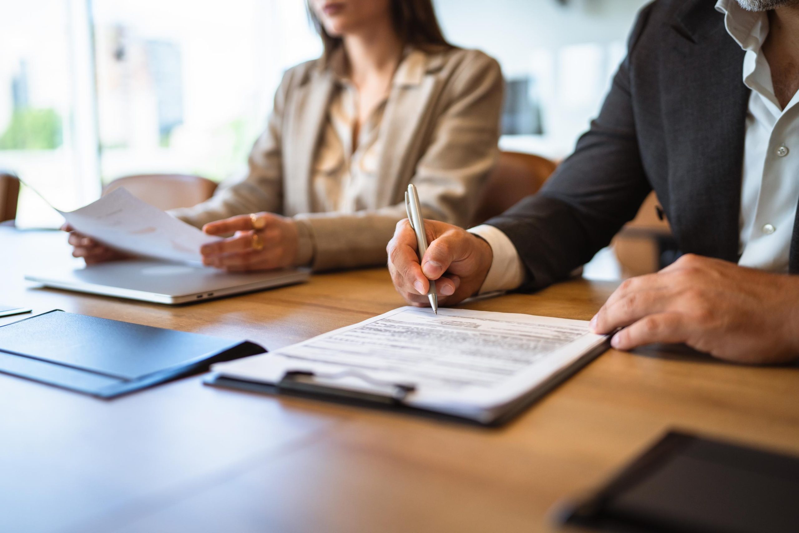 Close up on businessman sign business document or contract